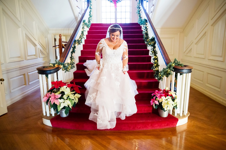 Bride walks down red staircase at Allerton Park Wedding by Rachael Schirano Photographer