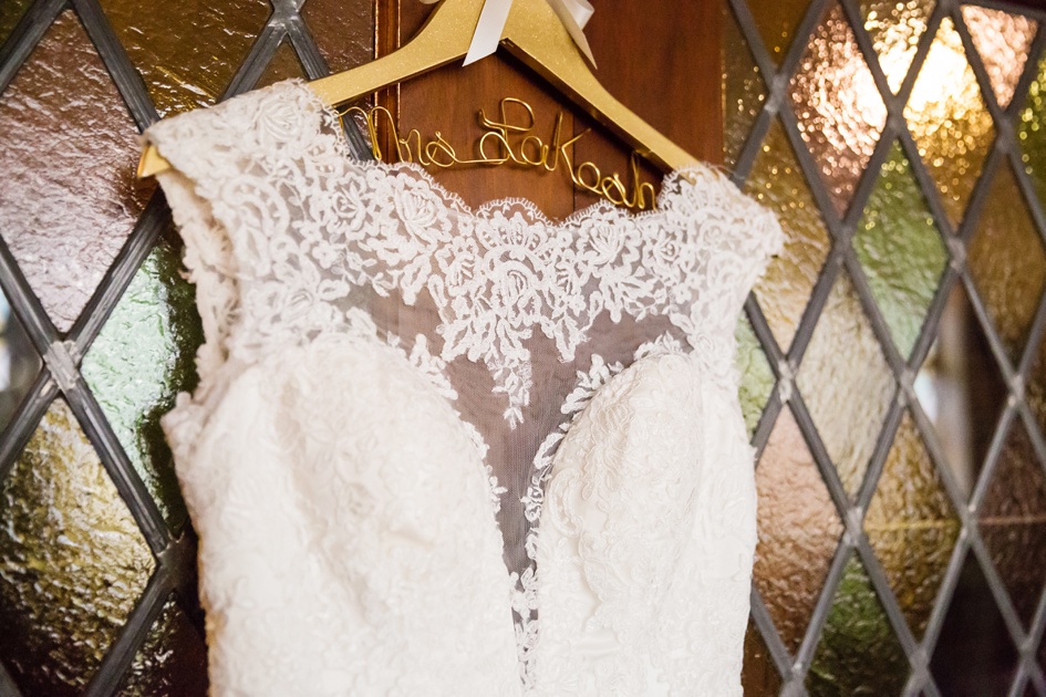 wedding dress hanging on custom wire wood hanger
