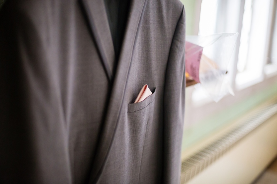 groom suit with pink pocket square