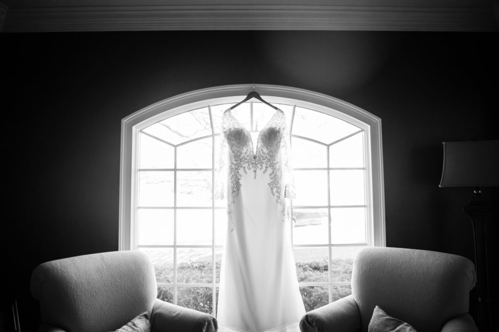 Bloomington IL wedding photographer, Central Illinois wedding photographer, Peoria IL wedding photographer, Champaign IL wedding photographer, winter wedding, black tie wedding, black white and red wedding colors, wedding dress hanging in the window
