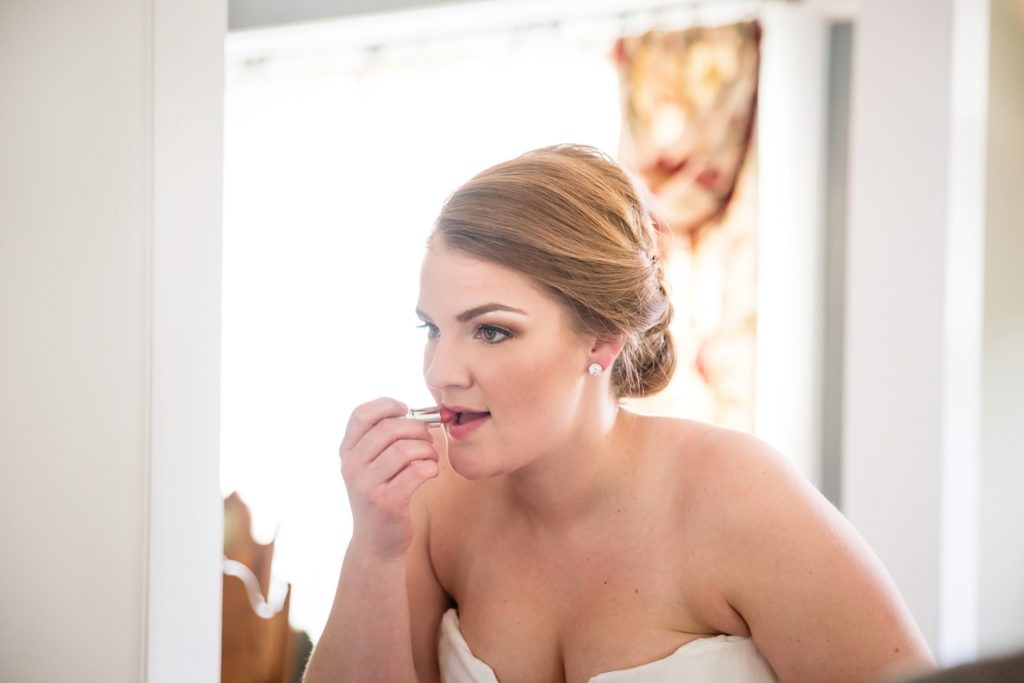 Bloomington IL wedding photographer, Central Illinois wedding photographer, Peoria IL wedding photographer, Champaign IL wedding photographer, blush pink and navy blue wedding colors, romantic wedding, bride getting ready, bride putting on lipstick