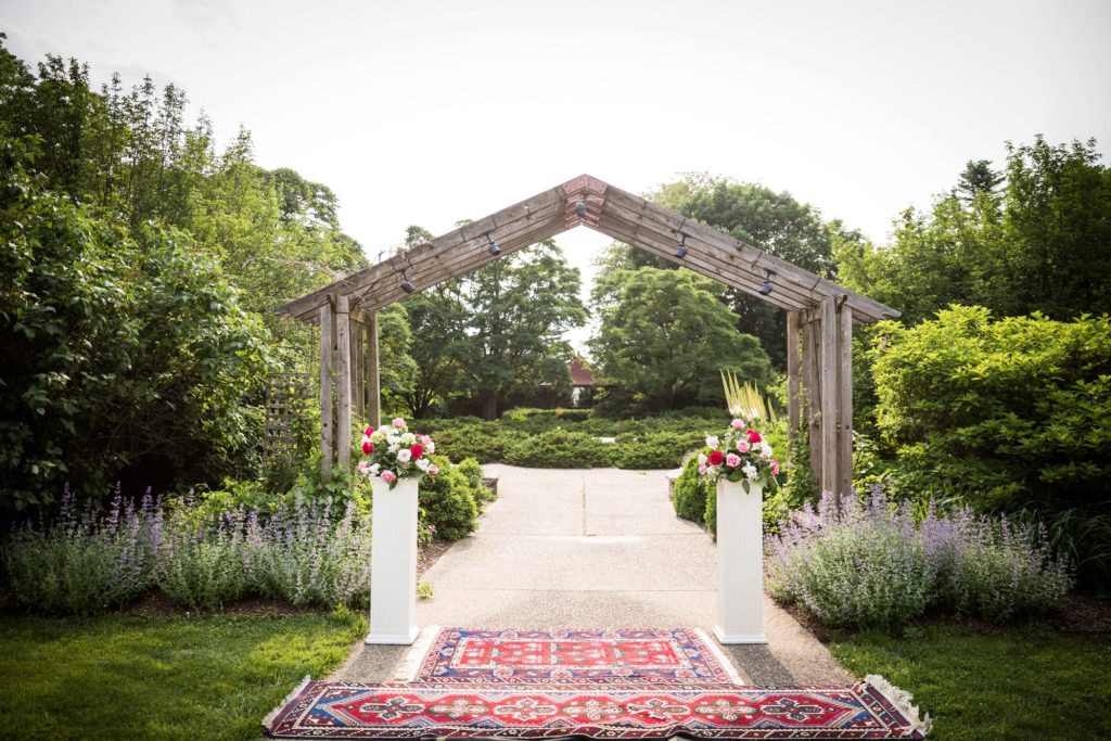Bloomington IL wedding photographer, Central Illinois wedding photographer, Peoria IL wedding photographer, Champaign IL wedding photographer, royal and baby blue wedding colors, outdoor wedding ceremony, garden wedding, wooden arbor ceremony backdrop, red wedding ceremony rugs