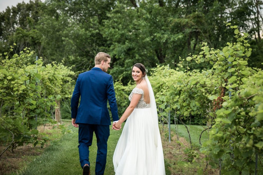 Bloomington IL wedding photographer, Central Illinois wedding photographer, Peoria IL wedding photographer, Champaign IL wedding photographer, Tuscany inspired wedding venue, blue and champagne wedding colors, lakeside wedding, vineyard wedding inspiration, bride and groom portraits in vineyard