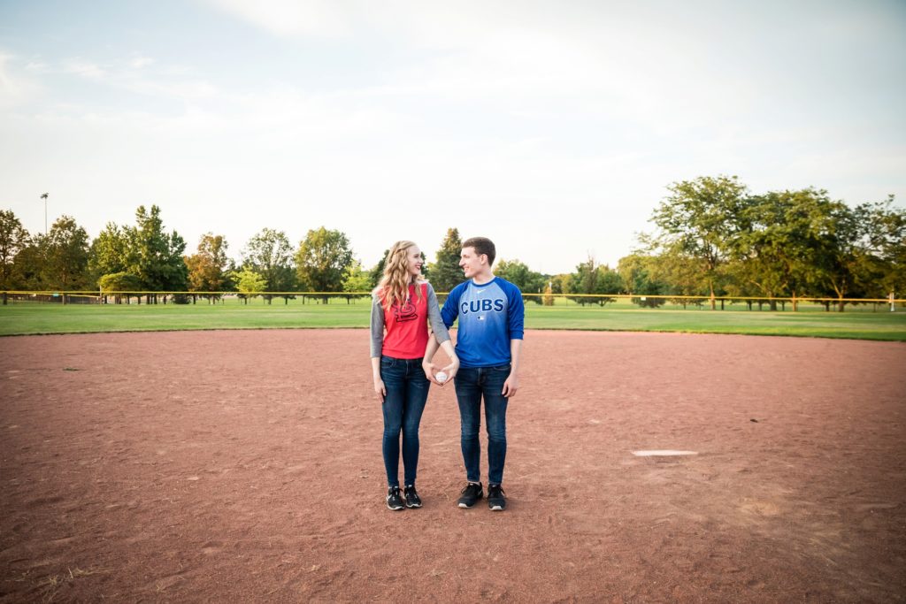 Bloomington IL engagement session, Central Illinois engagement photographer, what to wear for your engagement session, couple's portraits, engaged couple, outdoor engagement, formal engagement photos, baseball engagement session, sports teams engagement outfits, save the date baseball photos